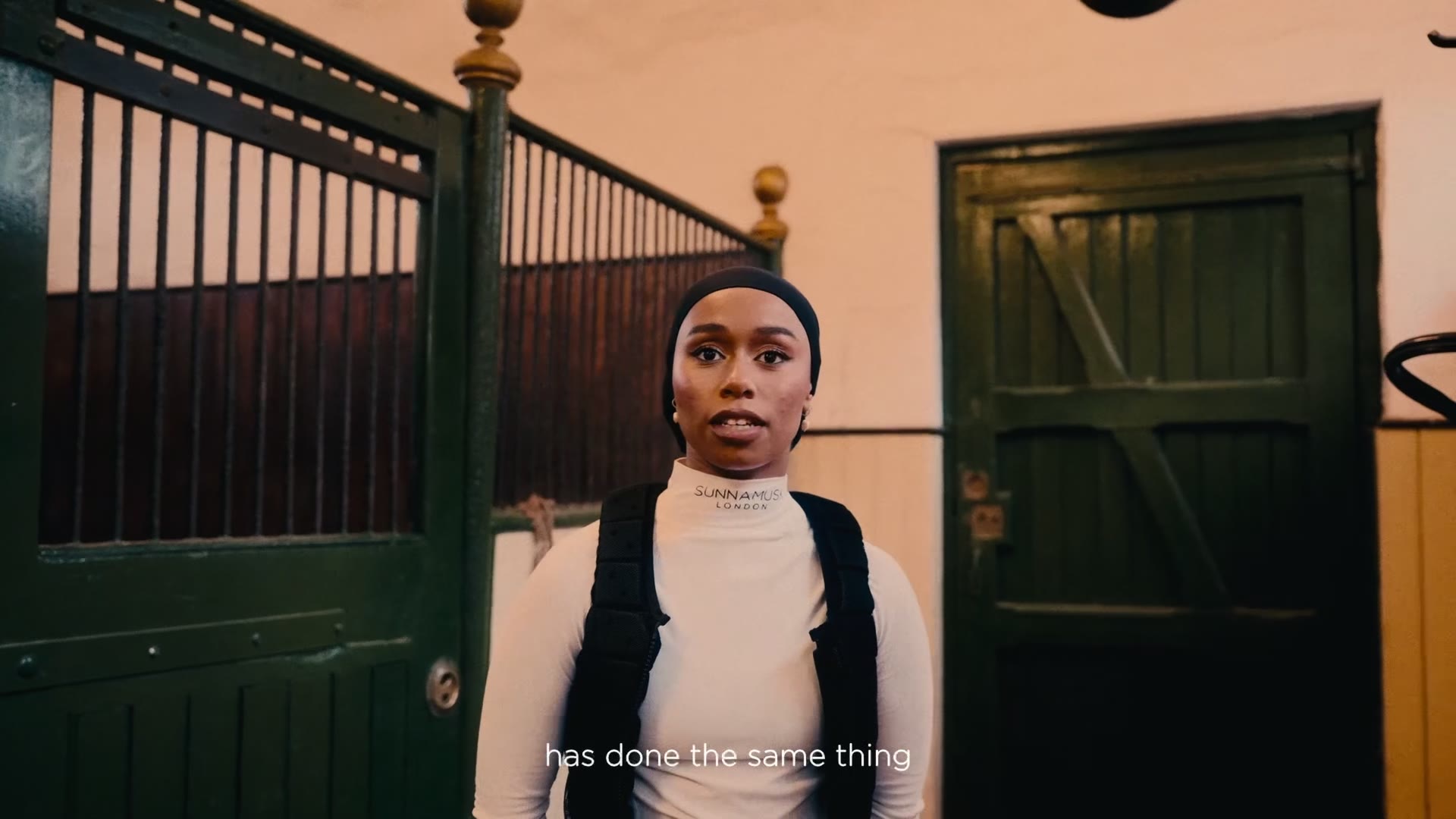 Khadijah Mellah standing in a stable yard