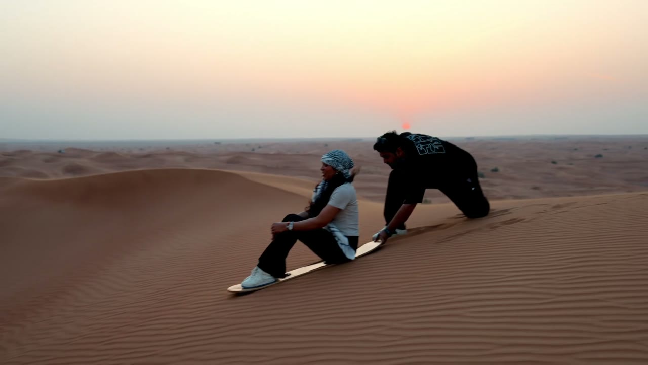Sandboarding at sunset