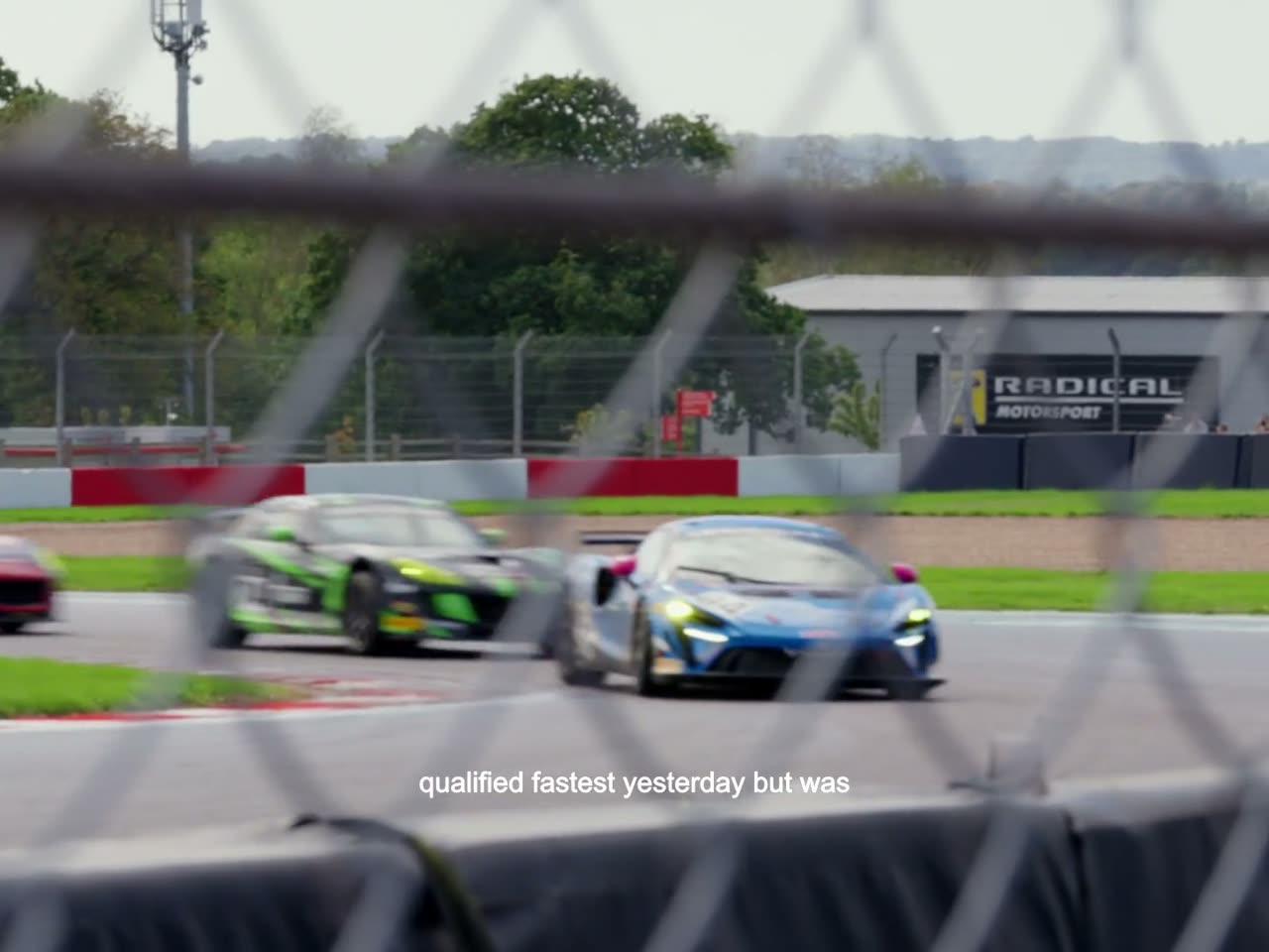 Through the trackside fencing