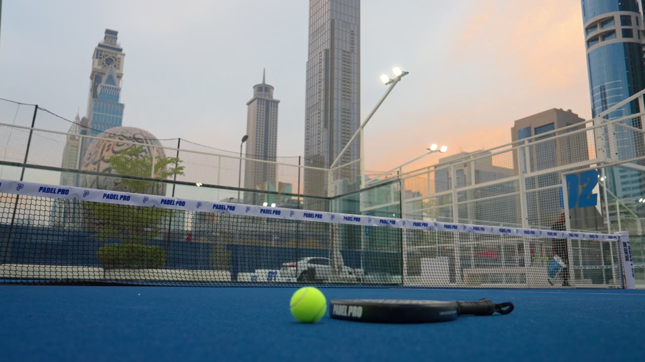 A ball and a racket, as the light goes